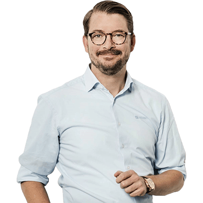 Erick Thürmer, 3. generations ejerleder, ekspert i kunstig intelligens og grøn omstilling, professionelt profilbillede med glad udtryk i ansigtet